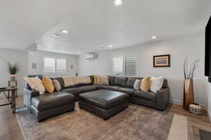 High end solid surface flooring. Can lights. Large windows. Massive vinyl window slider leading out to expansive entertaining deck.  Would make a great game room as well.