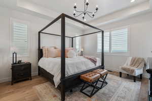 Main Level Primary Ensuite! Abundant windows. Access to upper deck. Can lights. Beautiful chandelier. Dual Sink Vanity. European style glass, oversized shower. Walk in closet (professional organizers).