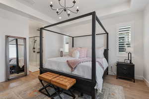 Main Level Primary Ensuite! Abundant windows. Access to upper deck. Can lights. Beautiful chandelier. Dual Sink Vanity. European style glass, oversized shower. Walk in closet (professional organizers).