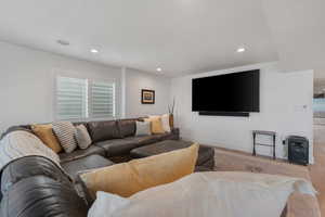 High end solid surface flooring. Can lights. Large windows. Massive vinyl window slider leading out to expansive entertaining deck.