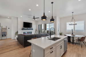 Quartz tops! Floor to ceiling cabinets. Pantry. Beautiful pendants. Under cabinet lighting. Stainless steel appliances. Gas range.