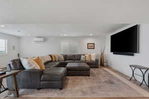 High end solid surface flooring. Can lights. Large windows. Massive vinyl window slider leading out to expansive entertaining deck.