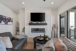 High ceilings. Electric Fireplace w/ remote. Massive vinyl slider. Solid surface flooring throughout.