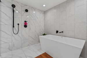 Lovely Spa/Resort Style Full Bath!! Multiple shower heads! Marble Tile! Relax after a long day or hitting it hard in the home gym!!!