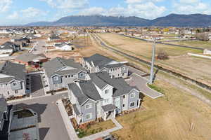Aerial perspective of suburban area featuring a mountainous background