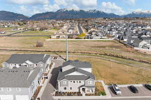 Aerial view of residential area featuring a mountainous background
