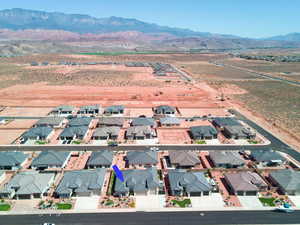 Aerial perspective of suburban area featuring a mountain backdrop