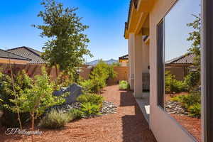 Fenced backyard featuring a mountain view