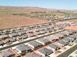 Aerial perspective of suburban area featuring a mountain backdrop