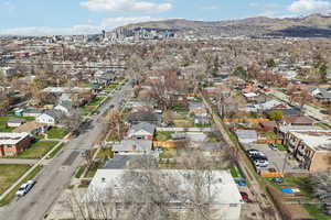 Aerial overview of property's location featuring a mountainous background