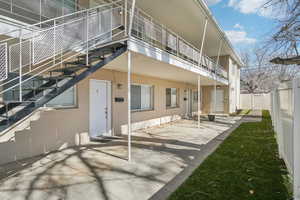 Back of house featuring stucco siding and a patio area