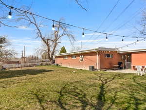 Rear view of property with a patio area