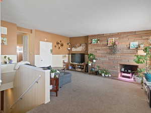 Living room with carpet in East unit