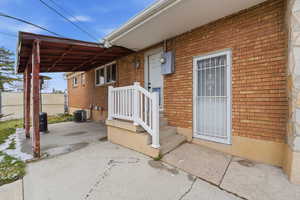Entrance to property with brick siding