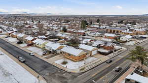 Snowy aerial view featuring a residential view