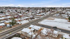 Snowy aerial view featuring a residential view
