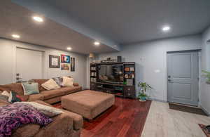 Living area featuring recessed lighting and wood finished floors