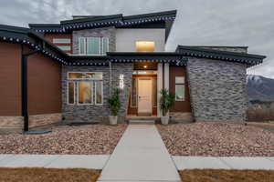 Property entrance featuring stone siding