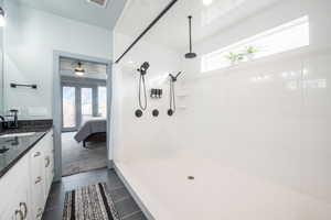 Full bathroom with ensuite bathroom, plenty of natural light, vanity, and a shower with curtain