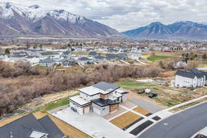 Aerial perspective of suburban area featuring a mountain backdrop