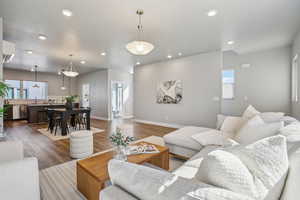 Living room featuring wood finished floors and recessed lighting
