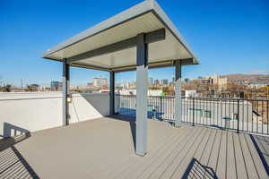 Wooden terrace featuring a view of city