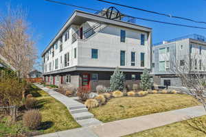 Modern home featuring stucco siding and brick siding