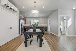 Dining space featuring light wood-style flooring and recessed lighting