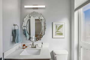 Bathroom featuring toilet and vanity