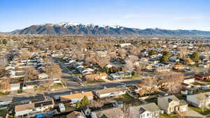 Aerial perspective of suburban area featuring a mountainous background