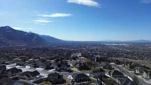 Aerial perspective of suburban area with a mountainous background