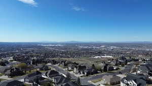 Aerial perspective of suburban area with a mountain backdrop