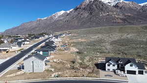View of mountain backdrop featuring nearby suburban area