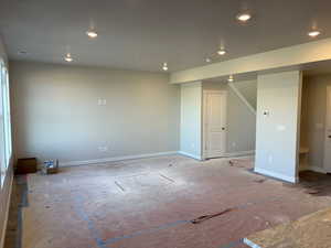 Unfurnished room with recessed lighting and baseboards