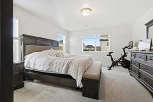 Master Bedroom featuring light colored carpet and baseboards