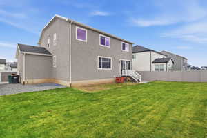 Rear view of house with stucco siding