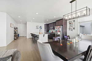 Dining room featuring light wood floors and recessed lighting