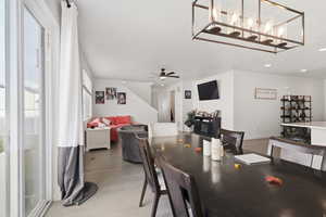 Dining area with a ceiling fan, recessed lighting, and light wood finished floors
