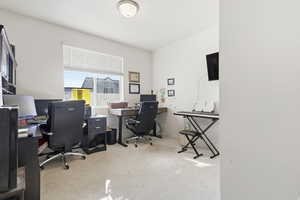 Bedroom/office featuring light carpet