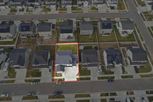 Aerial perspective of suburban area featuring property parcel outlined