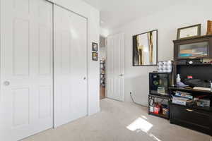 Bedroom/Office space with light colored carpet