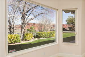 Unfurnished sunroom featuring a mountain view