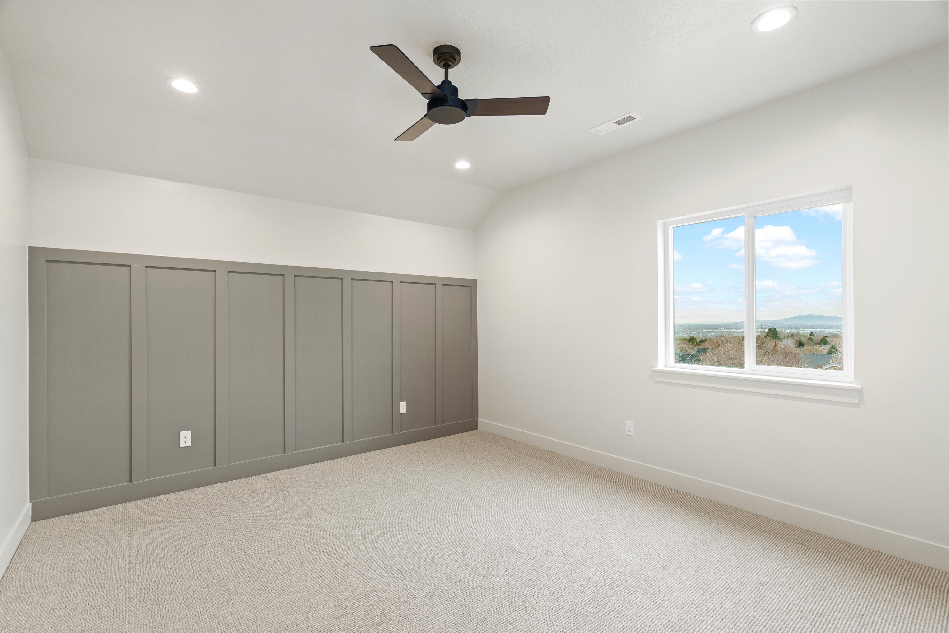 Unfurnished bedroom featuring light colored carpet, a ceiling fan, recessed lighting, a closet, and lofted ceiling