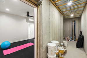 Bathroom with concrete floors and ceiling fan