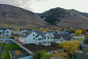 View of mountain backdrop featuring nearby suburban area