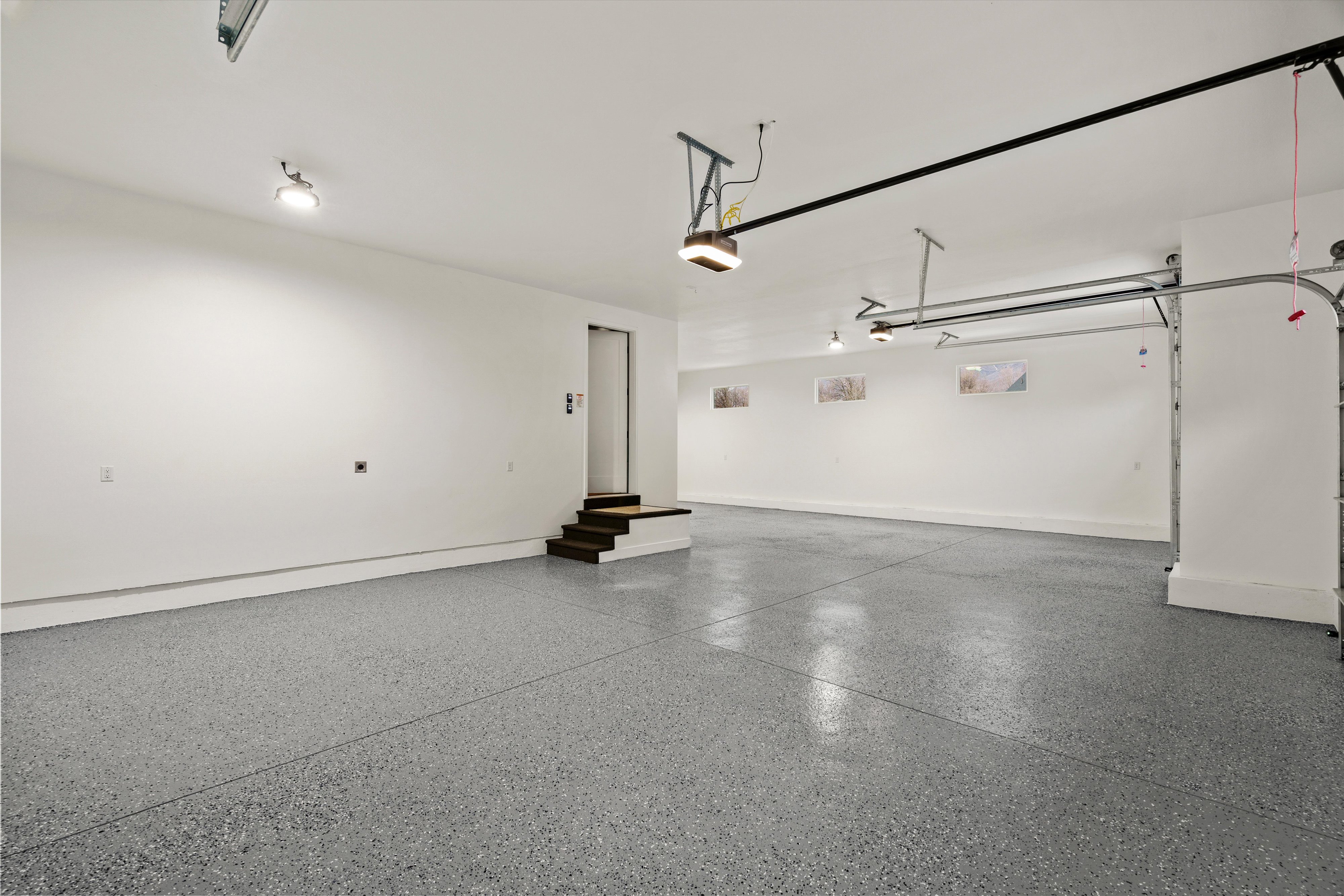 Garage featuring baseboards