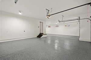 Garage featuring baseboards