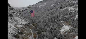 Exterior view of a mountainous background and a heavily wooded area