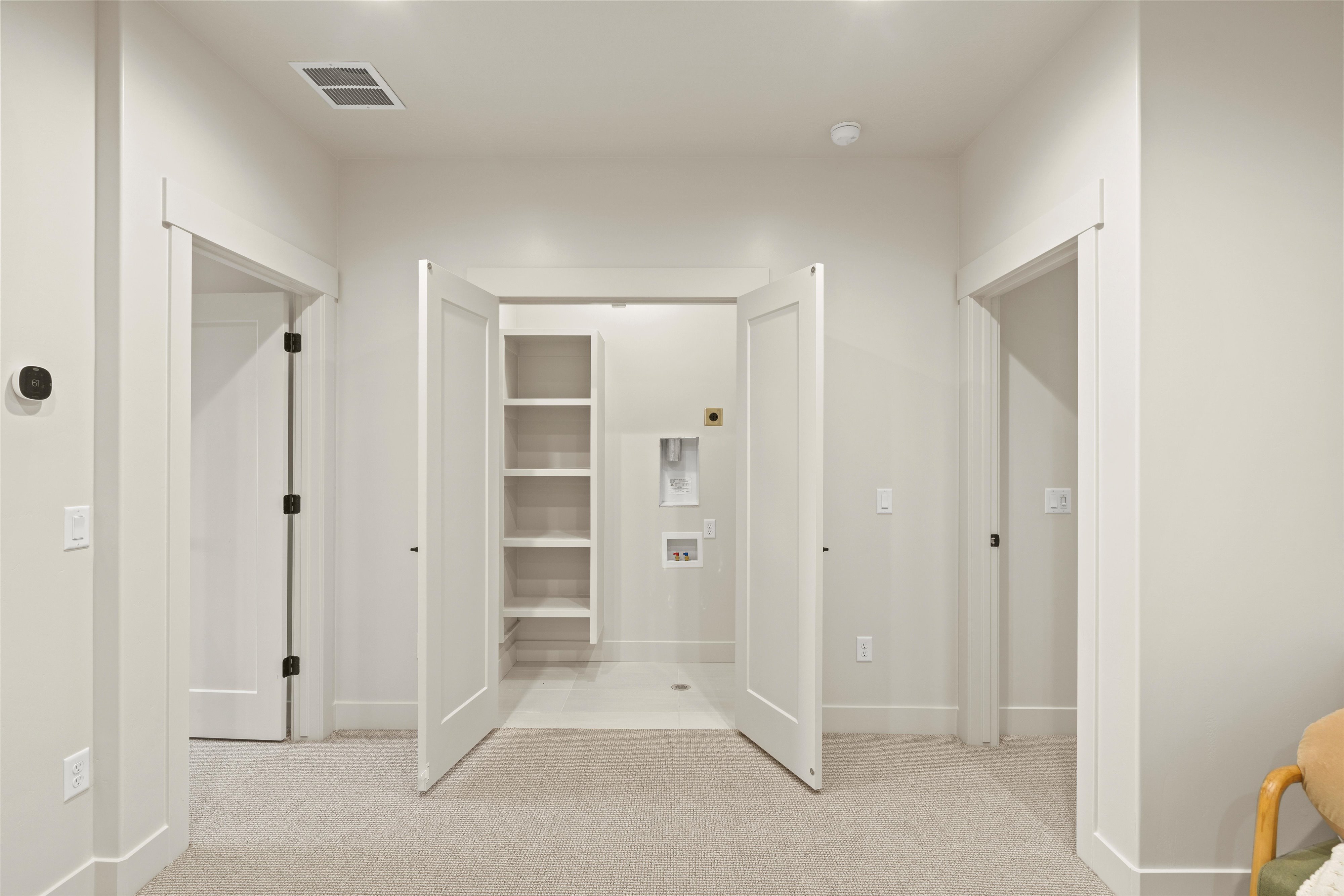 Unfurnished bedroom featuring light colored carpet