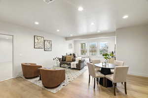 Dining room featuring light wood-style flooring and recessed lighting